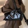 Vintage Leather Shoulder BagElevate your everyday look with sleek urban simplicity. Crafted in premium coffee-toned PU leather with a structured horizontal silhouette. Features a secure lock closure, built-in center divider, and double straps for effortless style.