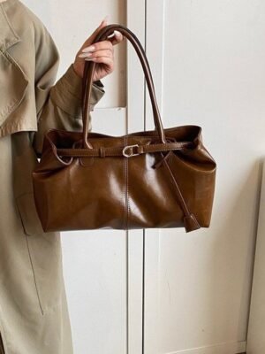 Vintage Leather Shoulder BagElevate your everyday look with sleek urban simplicity. Crafted in premium coffee-toned PU leather with a structured horizontal silhouette. Features a secure lock closure, built-in center divider, and double straps for effortless style.